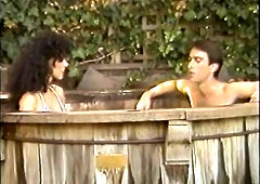 80s porn star Kimberly Carson sucks a bushy rod in a jacuzzi.