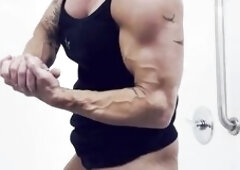 Greek Muscle Dominatrix-bitch Kandylegs flexes her hard muscles in the shower for u to cum hard.