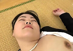 Formally dressed Asian office worker spills into intimacy on tatami