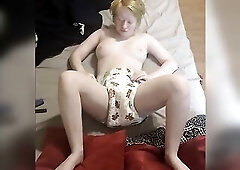 Opening and undressing CrinkleZ diaper change on couch