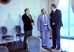 An Afro head of state arrives to stay, incognito, and causes mayhem with his parties and invited, female, guests, one of whom, Olinka, departs with th