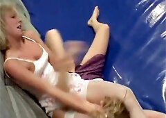 Blonde wrestler dominates her rival with brutal hair pulls on the mat