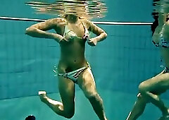 Two sexy amateurs showing off their bodies underwater