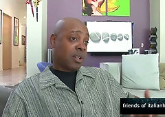 Dark-skinned beauty rides and serves deep oral to bald lover in sleek living room