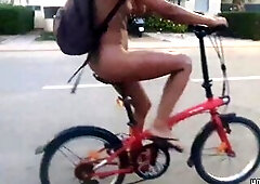 Wild Angel Biking Undressed on Public Road: Flaunting Her Body and Vagina!