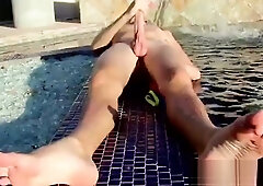 Blonde twink Tyler Thayer jerking his cock near the pool
