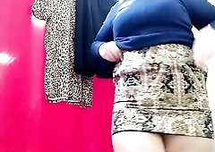Aged mother i'd like to fuck tries on skirts in the mall on her large butt