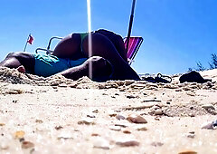 Beach voyeur films horny babe riding boyfriend's cock