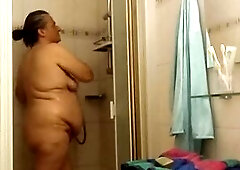 A truly chubby woman in the shower. Eva Pur shows her voluptuous curves and her real body in a totally natural way. Not a model, not perfection, but a