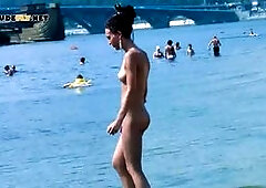 Hot nudist teen filmed by voyeur as she sits naked outside