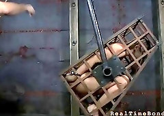 Caged woman is in the world of pain BDSM porn