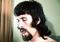 1970s vintage German porn, directed by Rainer Broenneke. Mr O picks up a breasty brunette hair, and takes her back to his apartment. His wife, Jeanett