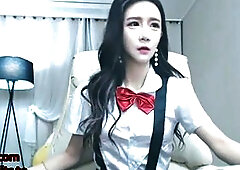Korean babe fucks herself in uniform and tights