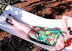 Red XXX stuffs her pussy with a toy in the hammock