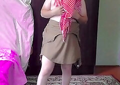 Gorgeous housewife crossdresser with white legs shows off in a miniskirt