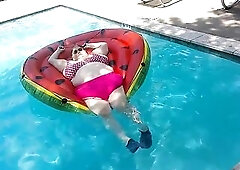 Large Cutie Nurse Vicki in her hawt pink bikini is floating on hr massive water melon float in the Apt pool ! Clothed movie tease