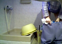 Unsuspecting woman in a bathroom caught on my