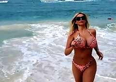 Busty babe playing with her big boobs
