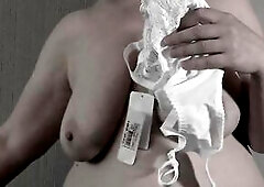 Trying on a brassiere. Aged big beautiful woman mother i'd like to fuck with large saggy melons.