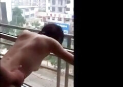 Asian Girl Shared at Open Window