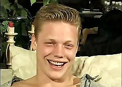 Curly blonde haired horny boy sucks balls and cock on the couch