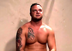 Oily athletic hunks wrestling jerk off