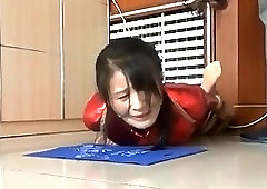 Sluty Asian girl enjoys BDSM and whipping on a floor