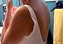 This video features a sexy mature redhead who is a cheerleader. She gives an amazing blowjob, taking her partner's cum in her mouth and then swal