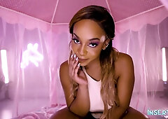 Dark-skinned beauty sucks and rides in a neon-lit pink boudoir