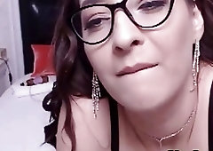 Shemale with glasses shows her perky tits and jerks off