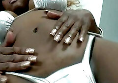 Black Tgirl with big tits in solo action