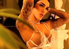 Big tittied bombshell in lingerie poses for photoshoot