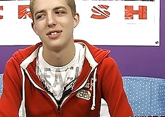 Smiling young homo jerks off and shoots his load out