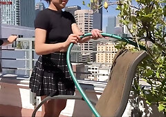 Eric John submits to a foot fetish session on a sunlit rooftop