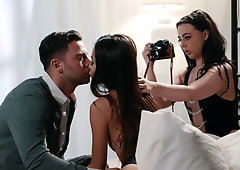 Vina Sky and Whitney Wright share a cock during photoshoot