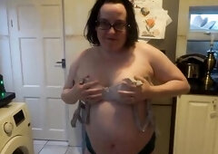 Rave hair Stepmom in the kitchen talked into stripping and cleaning in swimsuit showing off large tits