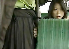One woman follows another woman onto a bus and things get very wet.