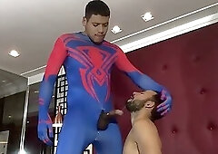 A hot young guy suffering on the dick of a well-endowed Spider-Man.