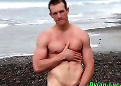 Outdoor surfer hunk tugs