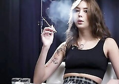 Smokin' in the studio with some nose exhales, some close up shots, some blows to camera
