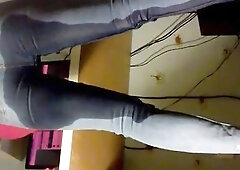 Emma pissing and working in constricted jeans