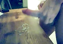 Hot cumming on the table after masturbation