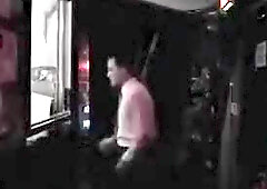 two leather men fucking in a dark room