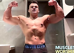 Young Alpha Bodybuilder Flexes Big Muscles