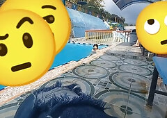 Dark-haired woman gives oral in a public pool bathroom before finishing with her dark-skinned lover in a hotel