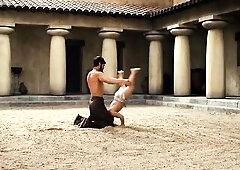 Carmen Electra sucking on a lollipop wearing a skimpy dress, doing a sexy dance. Then Carmen Electra naked seen lying on her back on a massage table. 