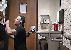 Sucking off a well-endowed boy in the mall bathroom!
