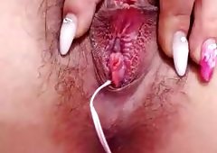 A Sex Toy On Her Crotch And One Deep Inside Her Vagina