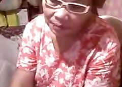 Sexy Asian granny Elizabeth, 57, loves to show off her stuff on webcam, flashing and teasing in this March 2014 video.