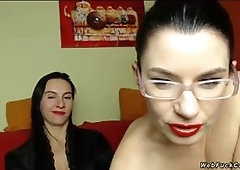Two brunette Milf lesbian bffs one of them with eyeglasses stripping and flashing pussies and playing with dildo in private live webcam show